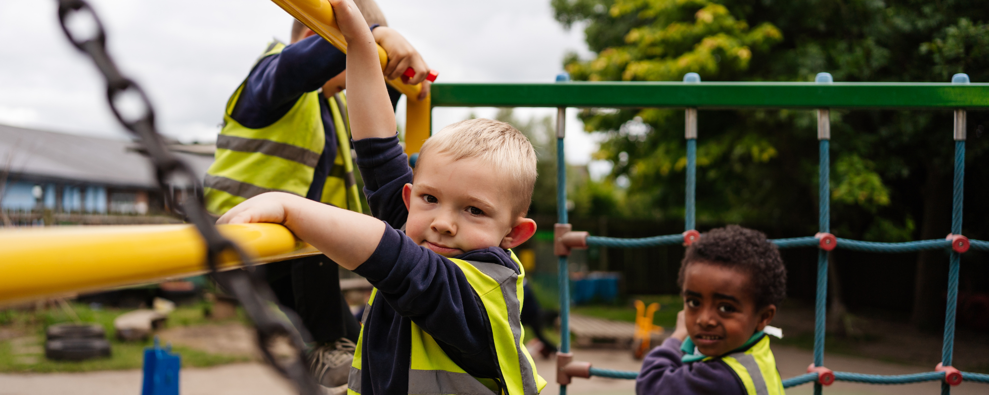 Header image showing children on tricycles